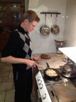 Walker cooking up his catch of wild mushrooms, seasoned with butter and rosemary.