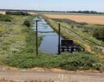Drainage canal and pumps on a Delta island.