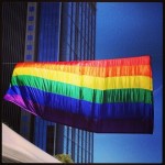 Giant rainbow flag above the festival