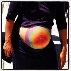 Rainbow bulls eye on the pregnant belly.
