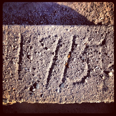 Year 1915 etched in concrete of North Fork Ditch at Folsom Lake