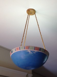 Clay bowl ceiling lamp suspended with twine rope.