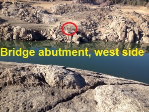 Within the red circle is the west side abutment. Suspension bridge water pipe landing on east side of American river.