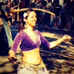 Belly dancing, sword balancing woman in the UCD Picnic Day Parade, 2014