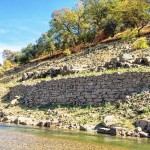 To support the South Fork Ditch along steep hill sides above the river local rock were used to create a retaining wall.