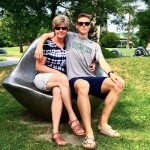 Walker sits with his mother on an eyeball bench sculpture at Williams College.