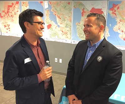 Certified Insurance Agent David Brabender discusses SEP conditions with Drew Kyler of Covered California at an agent forum hosted at Covered California in Sacramento.