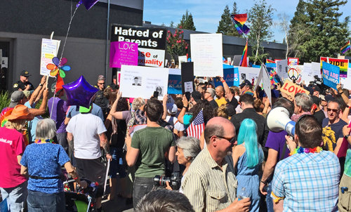Protester_surrounded_by_Sacramento_LGBT_love_Verity_church