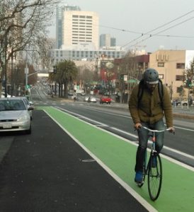 San Francisco and other major cities are beginning to create designated bike lanes and color coding the paths. http://sf.streetsblog.org/2015/01/16/eyes-on-the-street-new-bikeped-safety-tweaks-on-upper-market-valencia/