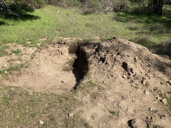 Another hole dug by mountain bikers to enhance their race course at Folsom Lake.