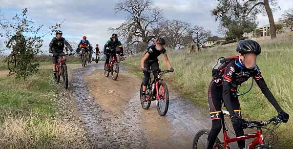 Packs of mountain bike riders descend upon the Folsom Lake trail riding as fast as they can with little regard for other people or the environment.