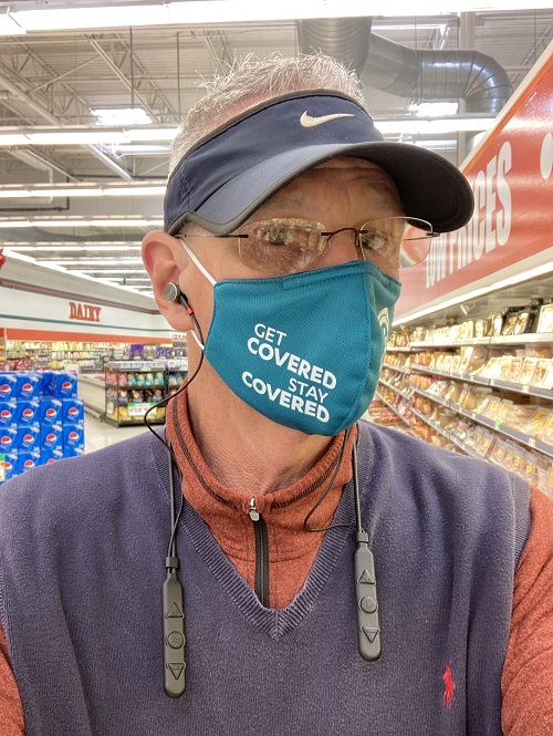 Kevin Knauss wearing the BeHear Access at the grocery store.