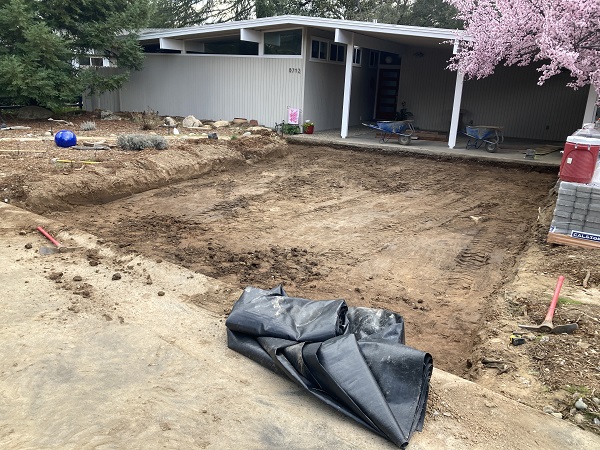 Excavated footprint of the driveway awaits the geotextile fabric.