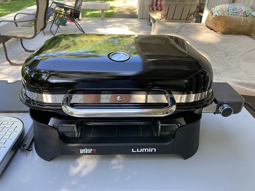 The Weber Lumin electric outdoor grill is compact and easily fits on table on our deck.
