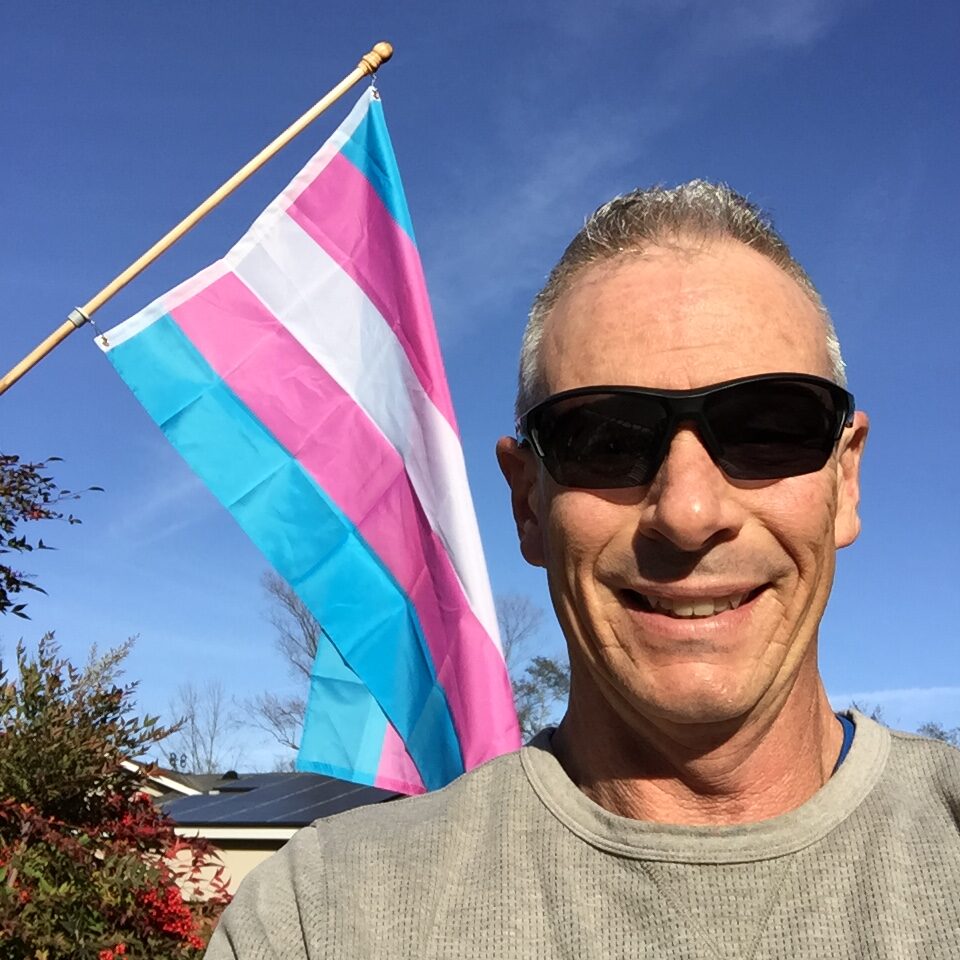 Kevin Knauss with his Transgender flag.