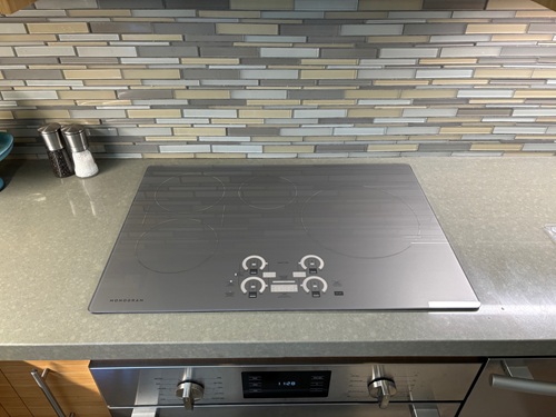 We chose the GE Monogram induction cooktop because it came in a silver surface color.