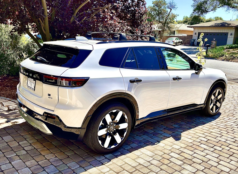 Side and rear of 2025 Prologue with roof rack cross bars installed and 8 inches of ground clearance.
